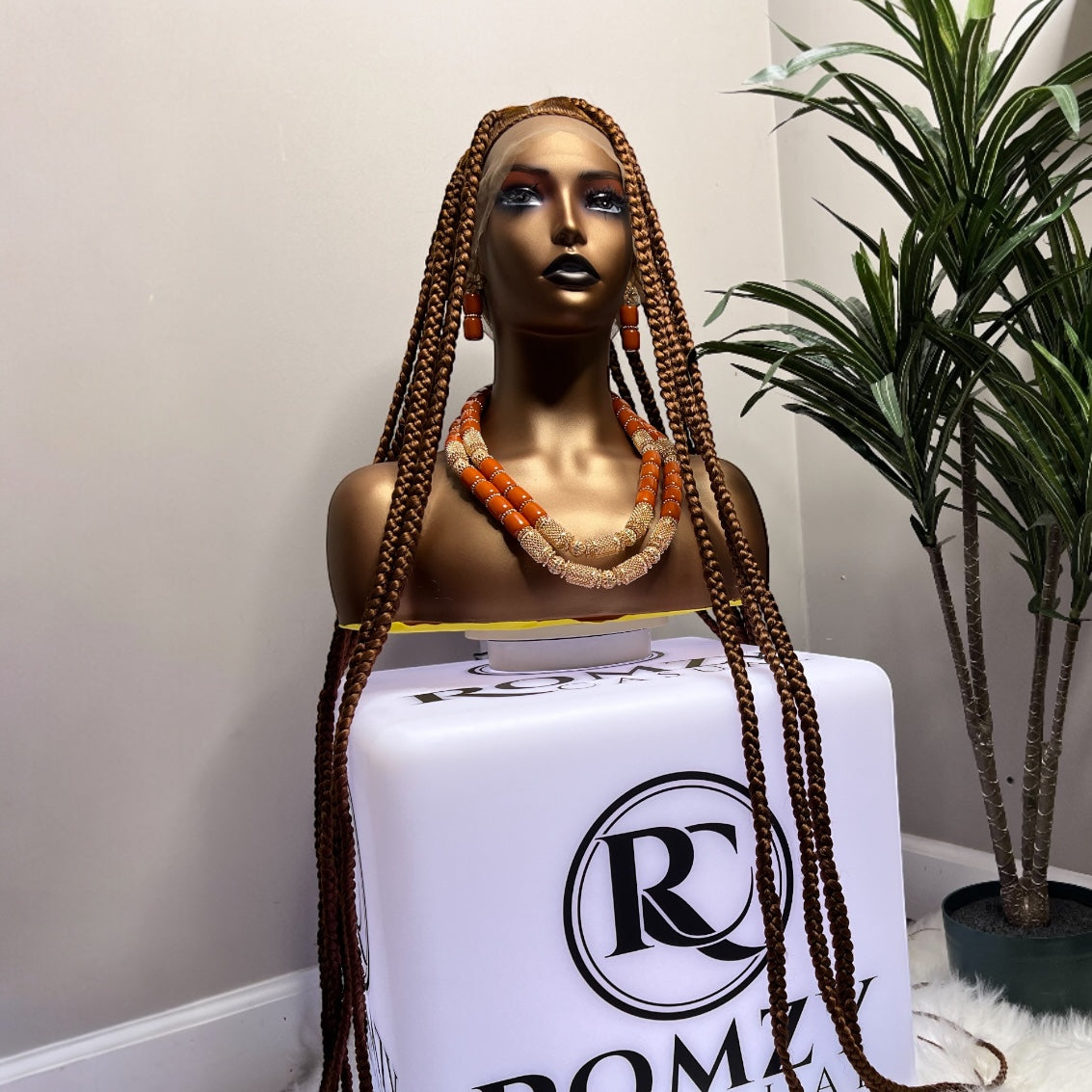 46-inch full lace braided wig on mannequin with long box braids and orange beaded necklace, ready to ship with free shipping