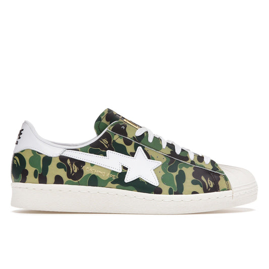 Adidas Superstar sneaker in green Bape ABC camo with white star logo and shell toe design